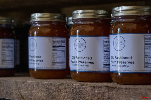 Jars of old fashioned peach preserves on a rustic shelf, ideal for advertisements.